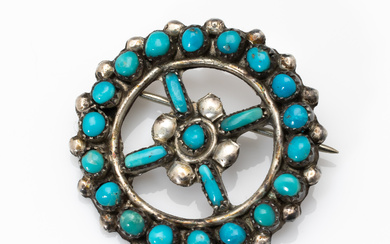 A vintage Navaho sterling silver and turquoise target design brooch...