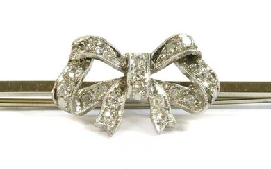 A white gold diamond set bow brooch, c.1925