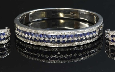 A white gold sapphire and diamond hinged bangle and earring suite