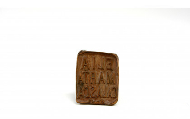 A wooden bread stamp