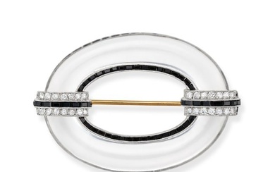 AN ART DECO ROCK CRYSTAL, ONYX AND DIAMOND BROOCH set with an open oval of polished rock crystal,...