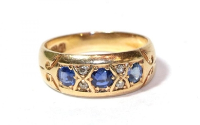 An 18 carat gold sapphire and diamond ring, finger size...