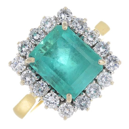 An 18ct gold Colombian emerald and diamond cluster