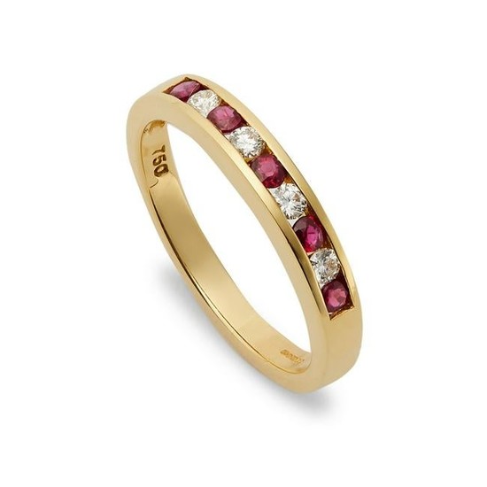 An 18ct gold ruby and diamond half hoop eternity ring.
