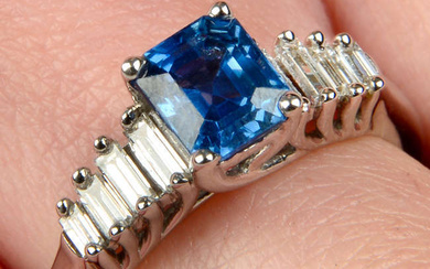 An 18ct gold sapphire ring, with graduated baguette-cut diamond line sides.