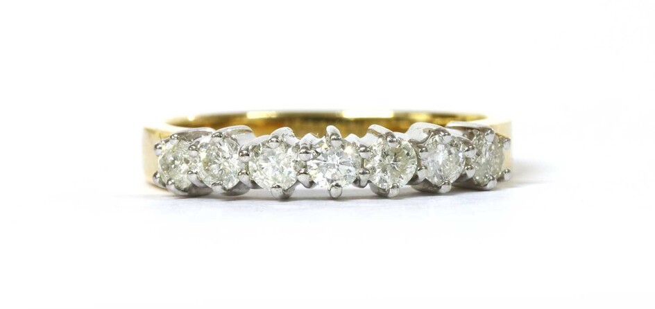 An 18ct gold seven stone diamond ring