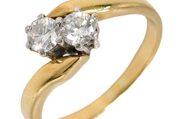 An 18ct yellow gold and diamond two stone crossover ring, se...