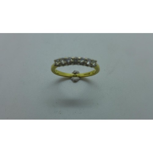An 18ct yellow gold diamond set half eternity ring set with ...