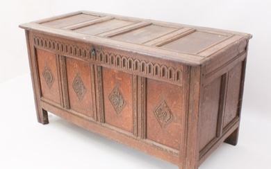 An 18th century joined carved oak coffer - the top with late...