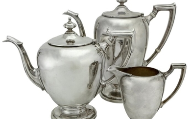 An American Silver Three Piece Tea Service by Reed and Barton Comprising: tea pot, hot water/c...