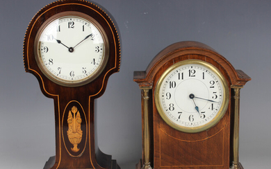 An Art Nouveau stained beech mantel timepiece, the shaped case with inlaid decoration, height 26.5cm