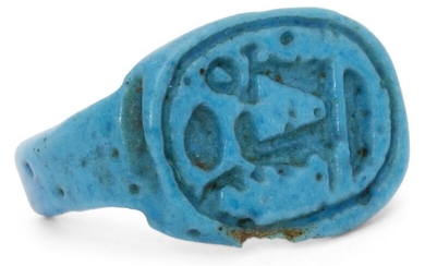 An Egyptian bright blue glazed faience ring inscribed with the...