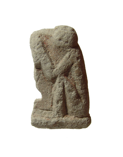 An Egyptian seated limestone amulet of a baboon