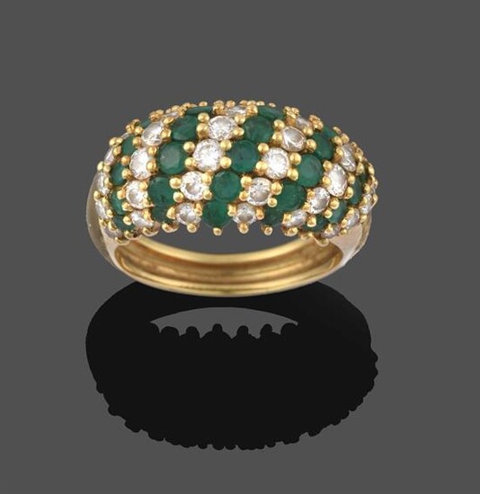 An Emerald and Diamond Ring, formed of eleven alternate rows...