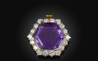 An amethyst and diamond brooch/pendant, claw-set with a hexagonal step-cut amethyst, within a border