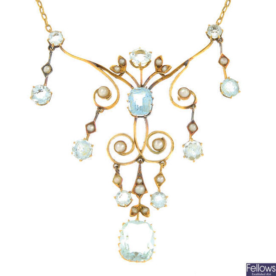 An early 20th century 15ct gold aquamarine and split pearl necklace.