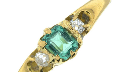 An early 20th century 18ct gold emerald and old-cut diamond three-stone ring.