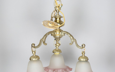 An early 20th century gilt brass three-branch chandelier with opaque frilled glass shades, height 46