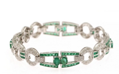An emerald and diamond bracelet set with numerous emeralds and diamonds, totalling app. 2.20 ct., mounted in 18k white gold. H/SI-P1. L. 18 cm.
