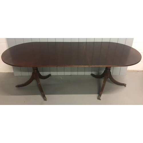 An extending, large classic Dining Table. Oval shaped, on tw...