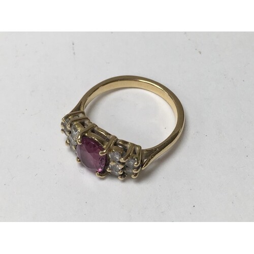 An unmarked 18ct gold and pink sapphire and diamond ring, 4....