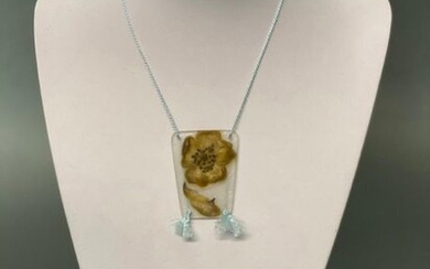 Argy Rousseau (French, 1885 ~ 1953) A pate-de-verre glass flower pendant on silk cord with tassels. Circa 1920. Pendant height 5.3 cm.