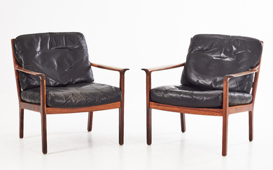 BRÖDERNA ANDERSSON. armchairs, a pair, 1960s, frame in jacaranda, black leather seat and back.