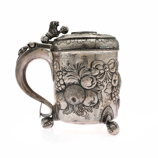 Baroque style silver tankard. Pseudo marks. 19th century. Weight 1060 g. H. 21 cm.