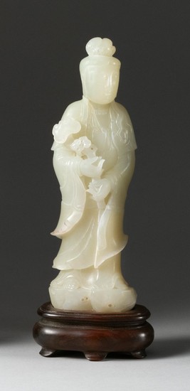 CHINESE WHITE JADE FIGURE OF GUANYIN Standing and holding a ruyi scepter. Height 8".