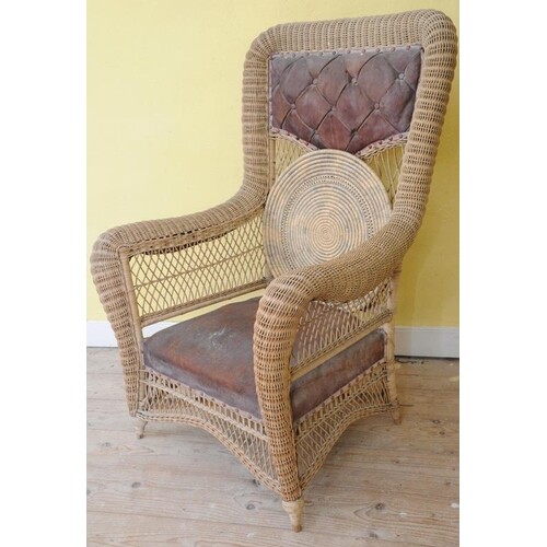 Edwardian style Lloyd Loom wicker armchair with leather back...