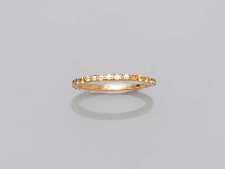 Fine yellow gold wedding band, 750 MM, highlighted with yellow sapphires, beautifully crafted, size: 54, weight: 2.15gr. gross.