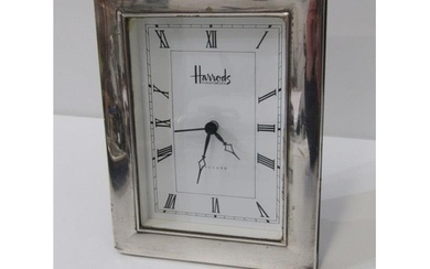 HARRODS SILVER CASED CLOCK, rectangular form silver framed d...
