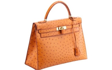 Hermès - a Kelly Sellier 32 in gold ostrich leather, 1999, tapered structured body with gold-to