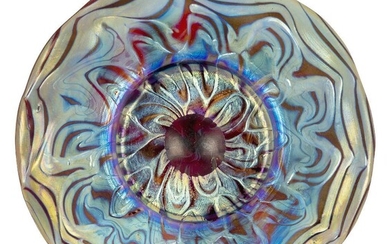 Loetz (Austrian), an iridescent Rubin Phaenomen glass saucer,c.1900, PG 7966, ground out pontil,The ruby glass covered with a gold iridescence on the top, the underside decorated with gold and blue wavy bands,16.5 cm diameter,Property from a...