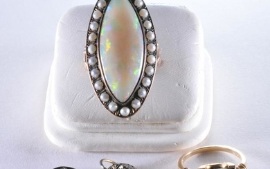 Lot of opal jewelry. Two rings, one set of earrings.