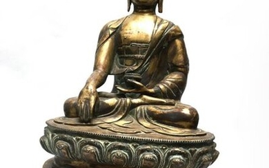 Medicine Buddha, bronze, sitting on a lotiform throne....