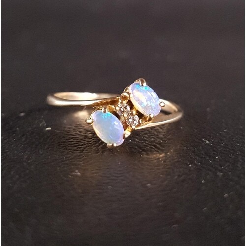 OPAL AND DIAMOND TWIST DESIGN RING the two opals separated b...