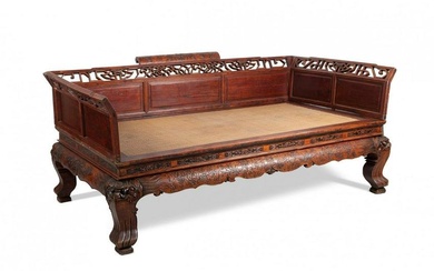 Opium smoking bed. China, Qing dynasty, 19th century. Huanghuali (rosewood) and rattan carved wood.