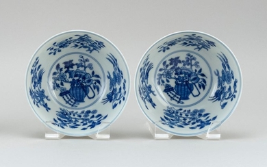 PAIR OF CHINESE BLUE AND WHITE PORCELAIN BOWLS In bell form, with a flower basket design surrounded by floral sprays. Six-character...