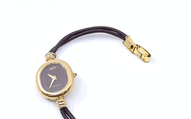 PEQUIGNET Montre bracelet, boîtier ovale en métal doré, bracelet en cuir et boucle doré