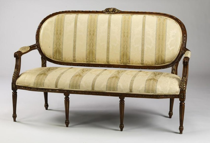 Parcel gilt Louis XVI style settee in striped damask