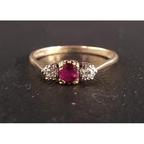 RUBY AND DIAMOND THREE STONE RING the central ruby approxima...