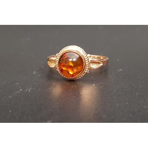 RUSSIAN AMBER SET RING the central round cabochon amber on f...