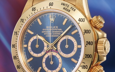 Rolex, Ref. 16528 An extremely rare and highly attractive yellow gold chronograph wristwatch with blue dial and bracelet, punched certificate and presentation box