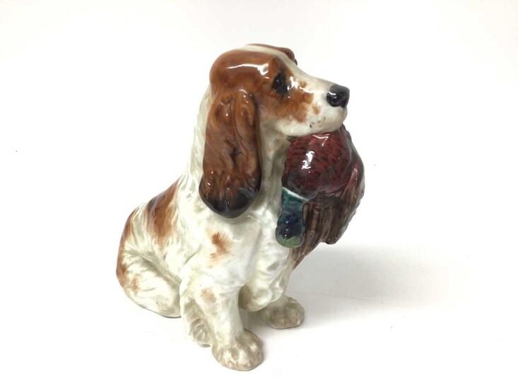 Royal Doulton figure of a spaniel with a pheasant in its mouth, 13.5cm high