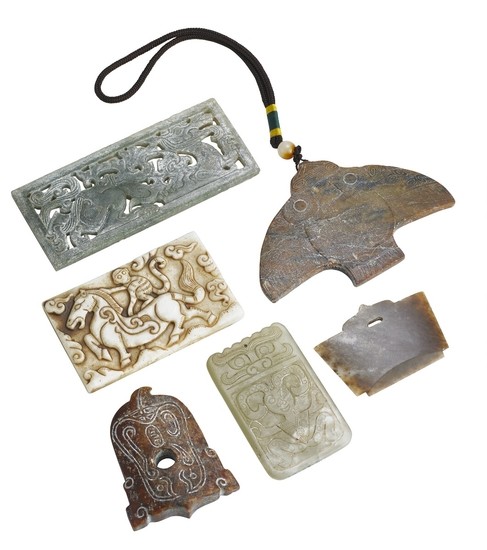 Six Chinese carvings and pendants of green, reddish and whitish jade. Weight 420 g. L. 6–12 cm. (6)
