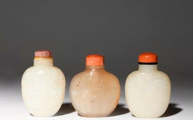 THREE CHINESE SNUFF BOTTLES 19TH CENTURY One carved in pale...