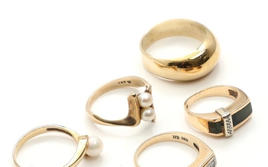 SOLD. Three rings of 8k gold and two rings of 14k gold, partly set with...
