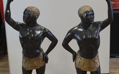 Two bronze sculptures of African men with torch, 20th century, h. 125 cm, Provenance: Landgoed Altembrouck (2x)