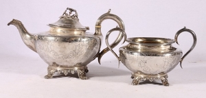 Victorian silver teapot and twin-handled sugar basket decora...